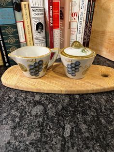 two bowls on a tray with books in the background