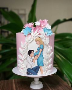 there is a cake decorated with an image of a man and woman on the side