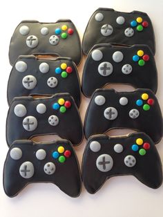 six cookies shaped like video game controllers