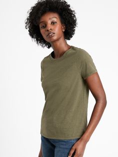 One of the world's finest cottons, SUPIMA® is American-grown and renowned for superior softness, extraordinary sturdiness, and vibrant color.  The remarkably strong fibers are naturally durable, comfortable and luxuriously soft. . Crew neck.  Short sleeves.  5/8" neck binding stabilizes the neckline so it keeps its shape without being bulky.  Taping at the back neck and shoulders for an ultra-smooth, ultra-comfy fit.  Straight hem.  Produced in a facility that runs P. A. C. E.  – Gap Inc. 's pro Classic Soft-washed Solid T-shirt, Classic Soft-washed T-shirt, Soft-washed Green Organic Cotton T-shirt, Solid Organic Cotton Soft-washed T-shirt, Solid Soft-washed Organic Cotton T-shirt, Tri-blend Crew Neck Tops In Solid Colors, Solid Tri-blend Tops For Everyday Wear, Solid Tri-blend Everyday Tops, Classic Green Relaxed Fit T-shirt