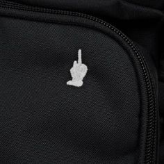 a black backpack with a white peace sign on it