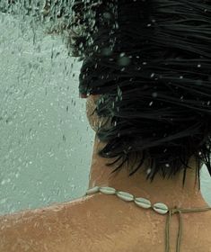 the back of a woman's head covered in water