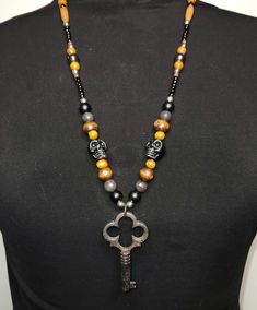 Proudly made by a Choctaw artist! This hand-beaded, rustic inspired necklace features a large metal key pendant with glass and stone beads. This stunning item has a bold visual presence, comfortable weight, and genderless versatility.  Please note: My jewelry peices are handmade and one-of-a-kind. I do not duplicate my items.  Buy this one, and no one will have anything like it! Skull Bead Necklace, Skeleton Key, Key Pendant, Hand Beading, Skeleton, Stone Beads, Native American, Key, My Jewellery