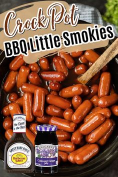 a bowl full of bbq little smokies next to a bottle of barbecue sauce