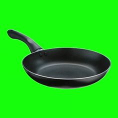 a frying pan on a green screen with the handle extended to the right side