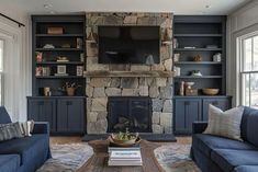 a living room filled with furniture and a fire place