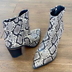 Turn Up The Heat On Your Evening Looks With This Chic And On-Trend Bootie Synthetic Reptile Upper With Pointed Toe Side Zipper Closure Lightly Cushioned Footbed 3" Block Heel Nwot And Excellent Condition Size 6 Black Snake Print Boots For Fall, Trendy Gray Ankle Boots, Fall Snake Print Ankle Boots, Black Snake Print Ankle Boots, Trendy Gray Pointed Toe Boots, Gray Ankle Boots For Fall, Gray Closed Toe Heels For Fall, Chic Gray Pointed Toe Boots, Gray Boots Medium Width For Fall