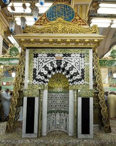 an elaborately decorated shrine in the middle of a building