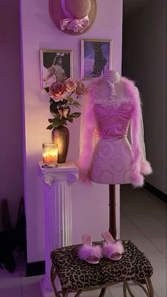 a pink dress and shoes are on display