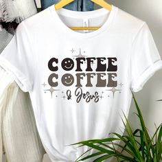 "These soft & comfy Bella Canvas t-shirts are sure to be your new \"must have more\" shirts!  Love Coffee tshirt Emoji t-shirt Vintage Smiley t shirt Vintage Coffee and Jesus shirt Faith tee Jesus and Coffee shirt Caffeine tshirt Womens graphic tshirt Womens Graphic Tee Gift for her Gift for women Womens gift Recommendations: *For a standard fit, stick with your typical size *For an oversized fit, size up *For a fitted shirt, size down. *Shirts are longer. Great for knots, Tucks, or nice coverage with leggings. *Unisex Cut. works great for Everyone! Women sizes: Small: 2-4 | Medium: 6-8 | Large: 10-12 | XL: 14-16 | 2XL: 18-20 | 3XL: 22-24 | 4XL: 26-28 Men sizes: Select your standard size. Details: *Soft, Breathable, & very comfy Bella + Canvas *Pre-shrunk fabric *Solid Colors: 100% combed Coffee-colored Graphic Tee With Funny Print, Coffee Colored Graphic Tee With Letter Print, Coffee-colored Graphic Tee With Letter Print, Coffee Color Graphic Tee With Letter Print, Coffee-colored Relaxed Fit T-shirt With Slogan, Relaxed Fit Coffee T-shirt With Slogan, Coffee T-shirt With Funny Print And Relaxed Fit, Coffee Colored T-shirt With Funny Print And Relaxed Fit, Coffee Colored T-shirt With Funny Print In Relaxed Fit