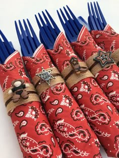 several red and white napkins with blue forks