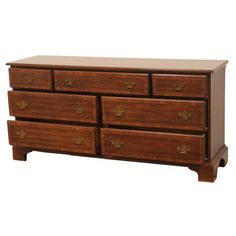 a wooden dresser with four drawers on one side and an open drawer on the other