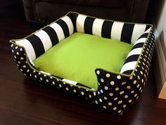 a black and white polka dot dog bed