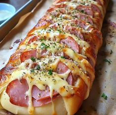 ham and cheese wrapped in melted cheese on bread