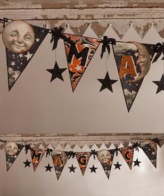 a room with some decorations hanging from the ceiling and stars on the wall next to it