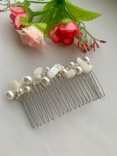 Simple beautiful mother of pearl hair comb. This crystal hair comb and pearl hair comb is decorated with a tiny silver plated beads, mother of pearl  gems and 4cm and 8cm pearl glass beads. All placed with non tarnish silver plated wire on a silver  hair comb  A really simple hair piece which has been carefully hand beaded to create this lovely gemstone hair comb  Due to the nature of the mother of pearl beads the decorative hair comb will be a unique piece to you. Please note as these combs are Gemstone Hair, Pearl Hair Comb, Decorative Hair Combs, Silver Hair Comb, Pearl Hair Combs, Crystal Hair Comb, Simple Hair, Tarnished Silver, Hair Comb Wedding