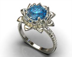 a blue diamond ring with diamonds around it