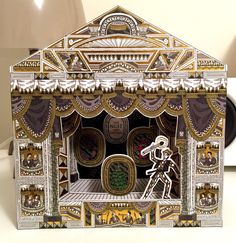 a paper model of a stage set made to look like it is being played on