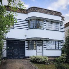 a white house with black doors and windows