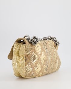 for more information on this item Brand - Chanel Model - Python Crochet Flap Bag Material - Python Colour - Beige Hardware - Ruthenium Accompanied by a Sellier dust bag Measurements – 28cm × 20cm × 7cm Code - 11 Series Date - 2006 - 2008 Ref - 030603 Please note we are not affiliated with the brands we sell Please note that all of our items are unless stated otherwise and purchasing through us is contributing to an ethical and sustainable fashion future. All our items come with an . All sales are final. You are making great choices for the planet and for yourself, Love Sellier. Luxury Beige Shoulder Bag With Chain Detail, Luxury Beige Shoulder Bag With Chain, Chanel Beige, Flap Shoulder Bag, Bag Measurements, Chanel Model, Gold Ounce, Colour Beige, Vuitton Bag