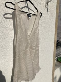 The top is very summery and suitable for festive occasions. It was bought in 2001. It is made of mulberry silk and is slightly transparent. Sheer Silk Tops For Night Out, Sheer Silk Party Tops, Silk Fitted Top For Beach, Fitted Silk Beach Top, Fitted Silk Top For The Beach, Summer V-neck Blouse For Night Out, Fitted Silk Top For Beach, Summer Silk Cocktail Tops, Sheer V-neck Top For Vacation