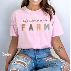 Life is better on the Farm Shirt, women's Farm Shirt, Cute Tee, Farmer Shirt, Gift for Farmer, pretty farm tee, Farm life T-shirt, Retro Tee The Comfort Colors 1717 is the ultimate garment-dyed t-shirt, made 100% with ring-spun cotton. The soft-washed, garment-dyed fabric brings extra coziness to your wardrobe while the relaxed fit makes it an excellent daily choice. The double-needle stitching throughout the tee makes it highly durable while the lack of side-seams helps the shirt retain its tubular shape. PRINT Printed using a Direct to Garment printing process using water-based biodegradable inks, that are non-toxic and eco-friendly. FABRIC .: 100% ring-spun cotton .: Medium fabric (6.1 oz/yd² (206.8 g/m .: Relaxed fit .: Sewn-in twill label WASHING INSTRUCTIONS Wash inside out in cold w Pretty Farm, Farm Tees, Farmer Shirt, Gifts For Farmers, Retro Tee, On The Farm, Dyed Fabric, Look Plus, The Farm