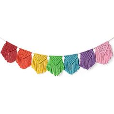 multicolored tasselled garland with fringes hanging on a string against a white background