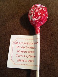 a candy lollipop with the words we are still suckers for each other, forty years later