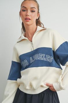 The iconic Los Angeles embroidery is a must-have staple in everyone's closet. Featuring long sleeves, color block detail, and a zipper at front. Made in an ultra-soft fabric. 55% Cotton, 45% Polyester. Imported and shipped iwth love from LA. Iconic Los Angeles, University Outfit, Capsule Wardrobe Essentials, Coordinating Outfits, Sweater Collection, Bachelorette Party Shirts, Sorority Shirts, Lifestyle Clothing, Fall Looks