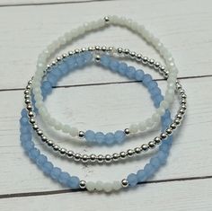 Momentum Bracelets Beautiful Beaded Bracelet Handmade with 4mm Icy Blue Glass Beads, 3mm Cloudy White Glass & 3mm Sterling Silver Beads Strung on High Performance Elastic. Buy Individual Bracelet or All Three as a Stack. Reference picture with name of bracelet next to image for bracelet name. Cloudy White Beaded Bracelet Sterling Silver Beading Bracelet Icy Blue Beaded Bracelet Select your Bracelet Size Handle Bracelets with Care: Roll bracelets on to avoid overstretching. Avoid perfumes, lotion Bracelets Stack, Beautiful Beaded Bracelet, Blue Beaded Bracelets, Sterling Silver Bead Bracelet, Trendy Bracelets, Diy Bracelet Designs, Reference Pictures, Pink Ivory, Silver Bead Bracelet