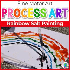 rainbow salt painting with the words fine motor art process art written in white and red