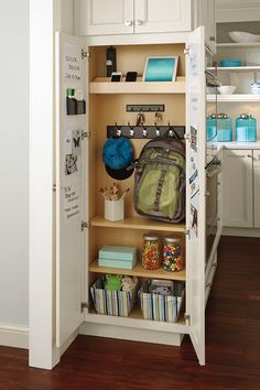 an open cabinet with many items in it