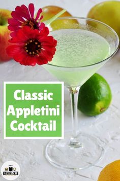 the classic appletini cocktail is garnished with an orange and red flower