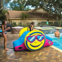 kids playing in the pool with an inflatable float