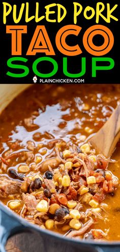 pulled pork taco soup in a large pot with a wooden spoon on the side