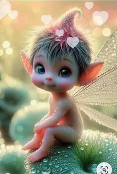 a cute little fairy sitting on top of a leaf