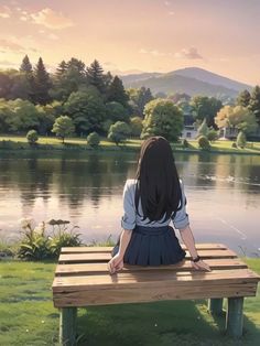 a woman sitting on top of a wooden bench next to a lake