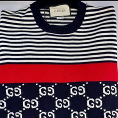 Gucci Gg Supreme Striped Knit Sweater. Gucci Sweater Is Crafted In Cotton With Jacquard Gg And Stripes. This Sweater Features A Ribbed Crew Neck, Long Sleeves, Red Tape Detail, And A Ribbed Hem And Cuffs. - Black Embroidered Sweater With Red And White Stripe - 100% Wool - Pull-Over Style, Long Sleeve Sweater - Embroidered Gg Pattern - Ribbed Detailing On The Collar, Bottom, Sleeves - Size M, L, Xl - Product Number 496458 - Made In Italy Black Designer Gucci Sweater, Gucci Designer Black Sweater, Black Gucci Designer Sweater, Gucci Black Winter Tops, Gucci Luxury Tops For Winter, Luxury Gucci Tops For Winter, Luxury Gucci Winter Top, Black Gucci Tops For Winter, Black Gucci Winter Top