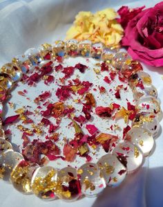 a plate that has flowers on it and some other things in the bowl next to it