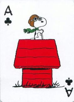 a drawing of a person sitting on top of a red house with cards in front of him