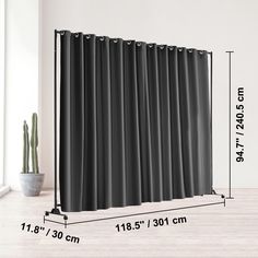 an image of a black curtain with measurements for the length and width in front of it