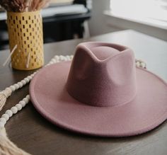 Made from colorful purple felt and formed into a chic fedora shape, this wide brim hat is the felted women's hat perfect for winter styling. Pair the cute hat accessory with winterwear favorites or trendy bohemian fashions for a pop of color. size adjustable 90% polyester, 5% cotton, 5% wool height: 4 ½” circumference: 24” brim width: 3 ½” Purple Wide Brim Hat, Spring Felt Fedora Hat, Trendy Felt Hat With Flat Crown For Fall, Trendy Flat Crown Felt Hat For Fall, Spring Fedora Felt Hat, Trendy Flat Brim Felt Hat For Winter, Trendy Short Brim Felt Hat For Winter, Spring Brimmed Felt Hat, Trendy Fitted Felt Hat For Winter