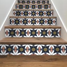 the stairs are decorated with colorful tiles