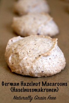 some cookies are sitting on a table with the words german hazelnut macaroons