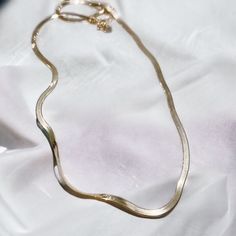 "Looking for the perfect elegant, easygoing accessory? We've got you covered with the herringbone Necklace in 18k Gold Vermeil. Featuring a large herringbone chain, this elevated necklace lets you easily switch up your look for every day and every occasion. Available in 18\" length. Metal 18k Yellow Gold Vermeil What is Vermeil?Vermeil (that's pronounced ver-may) is a gold plating technique that dates back to the 19th century. While other jewelers plate over less durable metals, our vermeil starts with a Sterling Silver base and is plated with just over 2.5 microns of 18k Gold to create a more timeless piece, worthy of the Demi-Fine name." Everyday Gold Plated Herringbone Necklace, Minimalist 14k Gold Snake Chain Necklace, Chic Gold Herringbone Necklace With Adjustable Chain, Elegant Herringbone Necklace With Adjustable Snake Chain, Minimalist Herringbone Necklace With Snake Chain, Elegant Delicate Snake Chain Necklace, Minimalist Gold-plated Herringbone Necklace With Delicate Chain, Minimalist Gold Plated Herringbone Necklace Tarnish Resistant, Minimalist Gold-plated Tarnish-resistant Herringbone Necklace