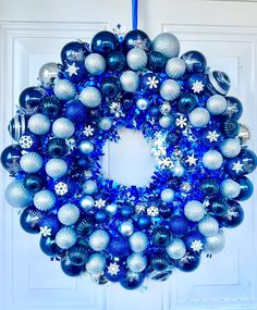 a blue and silver christmas ornament wreath