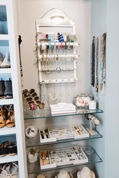 a closet filled with lots of shoes and jewelry