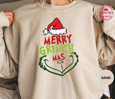 Get into the holiday spirit with our Merry Grinchmas Shirt and embrace the whimsical charm of the season. This Grinch Christmas Tee is perfect for those who love a touch of humor during the holidays. Our Holiday Shirt, designed for Women's Winter fashion, is a must-have addition to your festive wardrobe. The Holiday Tee is not just a piece of clothing; it's a statement of holiday cheer and style. Express your festive spirit with our Ugly Christmas Tee that stands out with its unique design and comfort. Shop now to elevate your seasonal style!  Etsy has it...! Please check Shirt and Sweatshirt sizes carefully.. Hi! Welcome to YiYuTee store, I'm so happy to see you here. My store's main goal is to make you happy. -We specialize in funny, customizable apparel shirts in different colors and st Womens Winter Shirts, Merry Grinchmas Shirt, Merry Grinchmas, Bah Humbug, Text Shirt, Winter Shirts, Holiday Shirt, Grinch Christmas, Christmas Tees