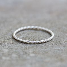 This stacking ring is a simple but yet beautiful jewel for your inner minimalist. It is a gentle and delicate piece, which you may wear alone or stacked. It is a great every-day jewel which will perfectly suit any occasion and any outfit. The ring is made of sterling silver. It is 1 mm thick. You see the ring of the 5.5 size in the pictures. You may order the ring of any size. If you are not sure about the size, this will be helpful: findmyringsize.com/ If you want to buy the ring as a gift and Simple Silver Stackable Rings For Everyday, Simple Silver Stackable Rings, Simple Sterling Silver Stackable Midi Rings, Simple Stackable Sterling Silver Midi Rings, Everyday Sterling Silver Stackable Rings With Simple Design, Simple Adjustable Sterling Silver Stackable Rings, Simple Stackable Rings With Round Band, Minimalist Sterling Silver Bands, Everyday Stackable Sterling Silver Rings