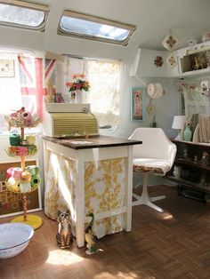 the inside of a camper with lots of furniture and decor